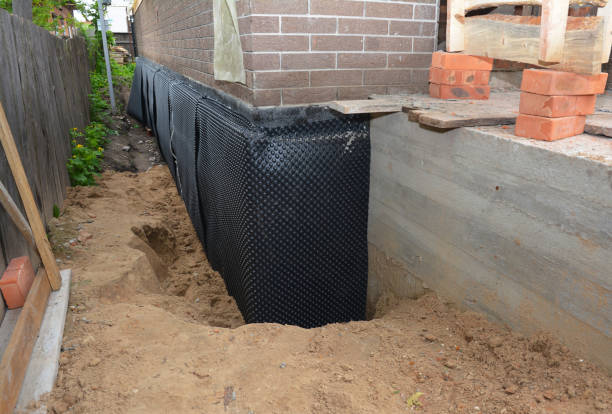 Happy homeowners after waterproofing job in Chatfield